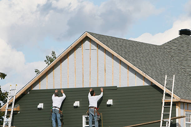 Professional Siding Installation technician working in Central City, IL